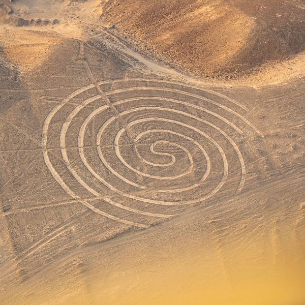 The timeless silence of the Nazca Desert Vast ochre landscape of the Nazca Desert seen from the aircraft