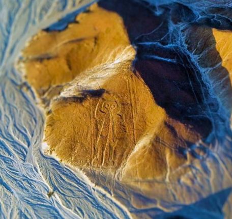 Nazca Lines Full Day Trip 4 The Astronaut geoglyph seen during the trip from Lima.