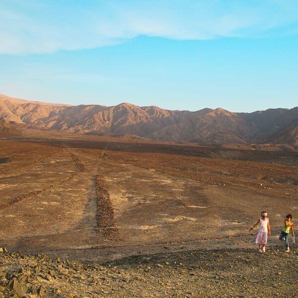 Desert landscape showing a Nazca Triangle geoglyph known as The Needles.