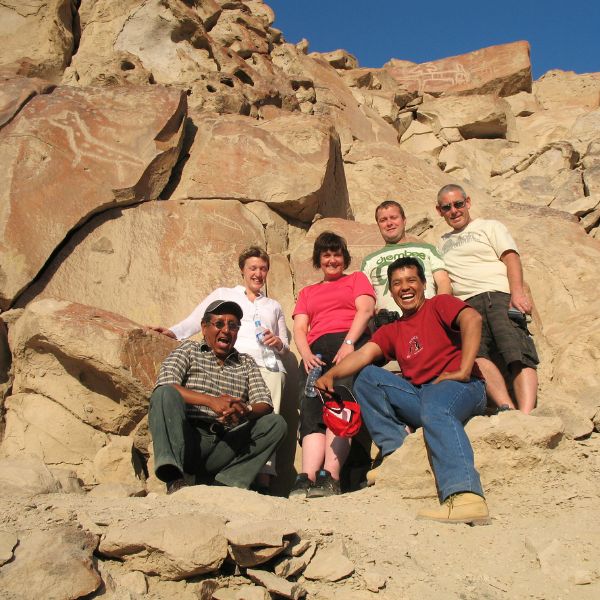 Our local guide with tourists in Chichictara Valley of Petroglyphs